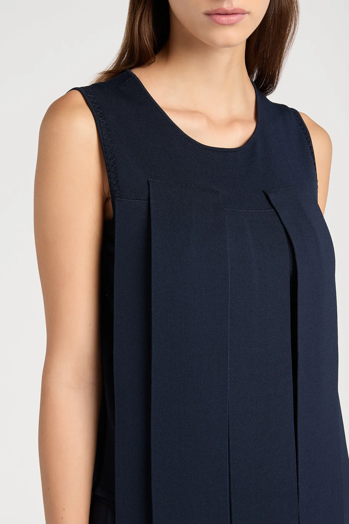NAVY TOP FEATURING PANEL DETAILS