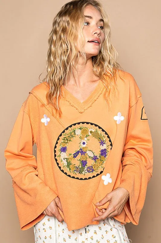 Orange Peace Embroidered Exposed Seam Back Ruffle V-Neck Top
